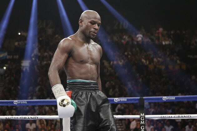 Floyd Mayweather Jr. stands in the ring during his WBC-WBA welterweight title boxing fight against Marcos Maidana Saturday, May 3, 2014, in Las Vegas. (AP Photo/Isaac Brekken)