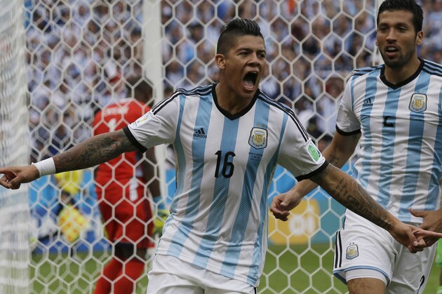 Argentina's Marcos Rojo celebrates scoring his side's third goal during the group F World Cup soccer match between Nigeria and Argentina at the Estadio Beira-Rio in Porto Alegre, Brazil, Wednesday, June 25, 2014. (AP Photo/Fernando Vergara)