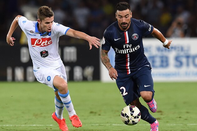 NAPLES, ITALY - AUGUST 11: Jorginho of Napoli and Ezequiel Lavezzi  of Paris Saint Germain in action during the pre-season friendly match between SSC Napoli and Paris Saint-Germain FC at Stadio San Paolo on August 11, 2014 in Naples, Italy.  (Photo by Giuseppe Bellini/Getty Images)