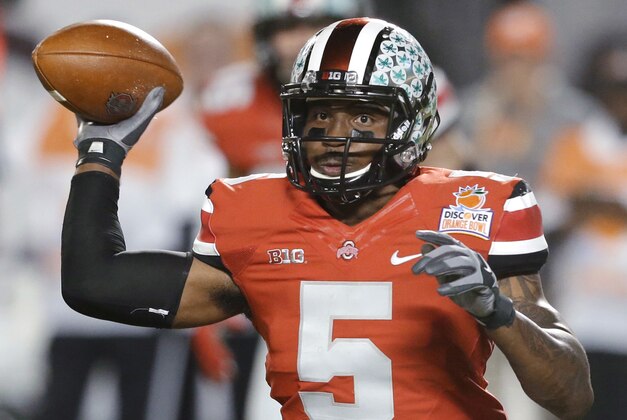 FILE -  In this Jan. 3, 2014 file photo, Ohio State quarterback Braxton Miller passes the football during the first half of the Orange Bowl NCAA college football game against Clemson, Friday, Jan. 3, 2014, in Miami Gardens, Fla. Ohio State ended the season with a two game losing streak. (AP Photo/Wilfredo Lee, File)