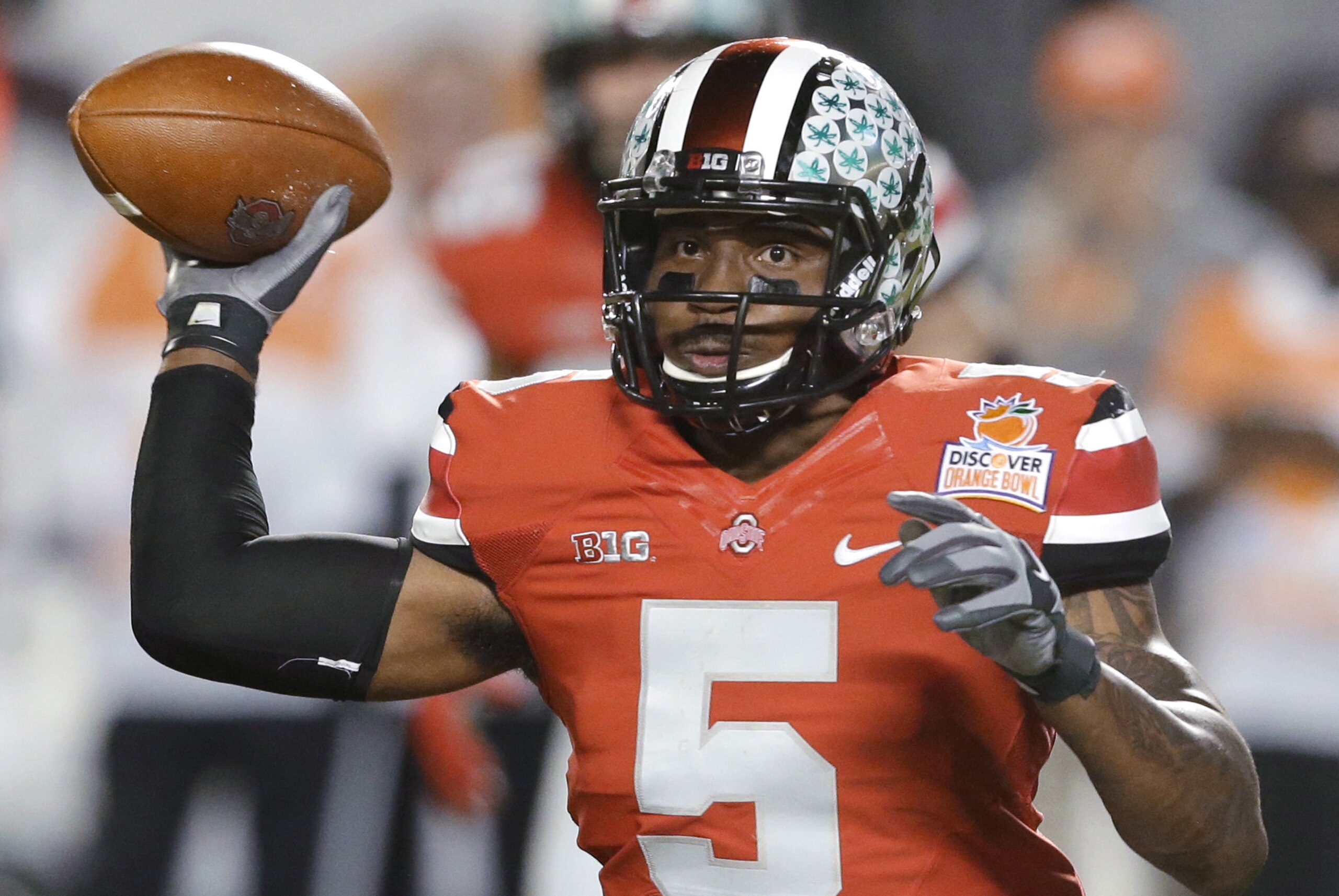 FILE -  In this Jan. 3, 2014 file photo, Ohio State quarterback Braxton Miller passes the football during the first half of the Orange Bowl NCAA college football game against Clemson, Friday, Jan. 3, 2014, in Miami Gardens, Fla. Ohio State ended the season with a two game losing streak. (AP Photo/Wilfredo Lee, File)
