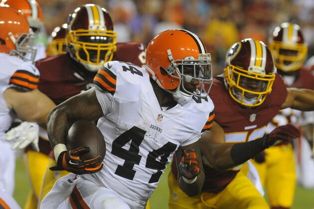 Cleveland Browns running back Ben Tate (44) runs from Washington Redskins defensive end Jarvis Jenkins (99) and linebacker Keenan Robinson (52) during the first half of an NFL preseason football game Monday, Aug. 18, 2014, in Landover, Md. (AP Photo/Richard Lipski)