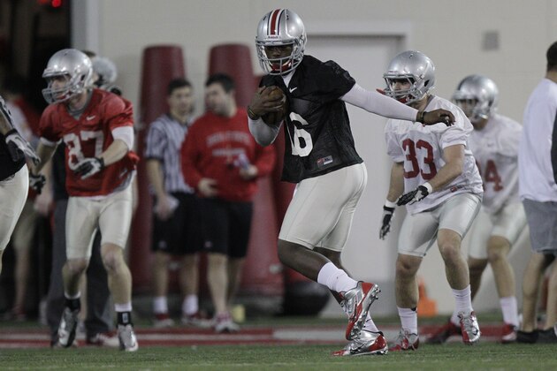 Ohio State quarterback JT Barrett warms up during their Spring NCAA college football practice Tuesday, March 4, 2014, in Columbus, Ohio. (AP Photo/Jay LaPrete)