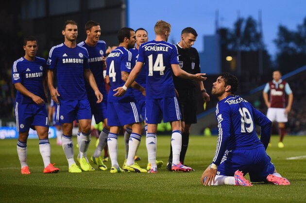 BURNLEY, ENGLAND - AUGUST 18: Chelsea players appeal to Referee Michael Oliver, as he books Diego Costa of Chelsea for diving during the Barclays Premier League match between Burnley and Chelsea at Turf Moor on August 18, 2014 in Burnley, England. (Photo by Laurence Griffiths/Getty Images) BURNLEY, ENGLAND - AUGUST 18: Chelsea players appeal to Referee Michael Oliver, as he books Diego Costa of Chelsea for diving during the Barclays Premier League match between Burnley and Chelsea at Turf Moor on August 18, 2014 in Burnley, England. (Photo by Laurence Griffiths/Getty Images)