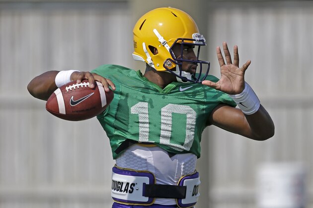 LSU quarterback Anthony Jennings (10) passes during their NCAA college football practice in Baton Rouge, La., Wednesday, Aug. 6, 2014. (AP Photo/Gerald Herbert)