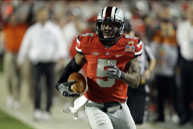 Ohio State quarterback Braxton Miller (5) runs on his way to scoring a touchdown during the first half of the Orange Bowl NCAA college football game, Friday, Jan. 3, 2014, in Miami Gardens, Fla. (AP Photo/Wilfredo Lee)