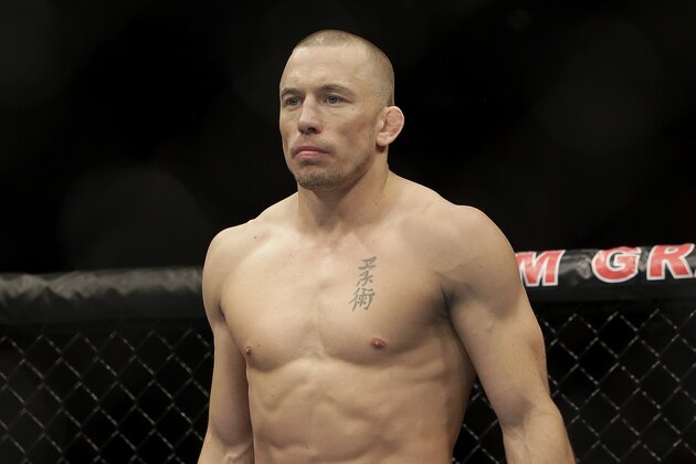 Georges St. Pierre, of Canada, waits to begin a UFC 167 mixed martial arts championship welterweight bout against Johny Hendricks on Saturday, Nov. 16, 2013, in Las Vegas. St. Pierre won by split decision. (AP Photo/Isaac Brekken)