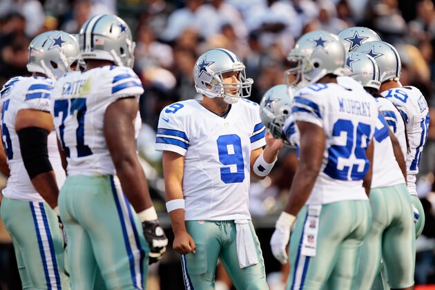 OAKLAND, CA - AUGUST 9:  Quarterback Tony Romo #9 of the Dallas Cowboys takes charge in the huddle against the Oakland Raiders in the first quarter of a preseason game on August 9, 2013 at O.co Coliseum in Oakland, California.  The Raiders won 19-17.  (Photo by Brian Bahr/Getty Images)