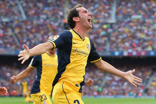 BARCELONA, SPAIN - MAY 17:  Diego Godin of Club Atletico de Madrid celebrates after scoring his goal during the La Liga match between FC Barcelona and Club Atletico de Madrid at Camp Nou on May 17, 2014 in Barcelona, Spain.  (Photo by Alex Livesey/Getty Images)