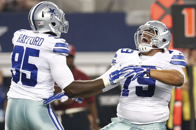 Aug 16, 2014; Arlington, TX, USA; Dallas Cowboys defensive end Zach Minter (79) celebrates a sack with defensive end Caesar Rayford (95) against Baltimore Ravens quarterback Keith Wenning (not pictured) in the fourth quarter at AT&T Stadium. The Ravens beat the Cowboys 37-30. Mandatory Credit: Matthew Emmons-USA TODAY Sports