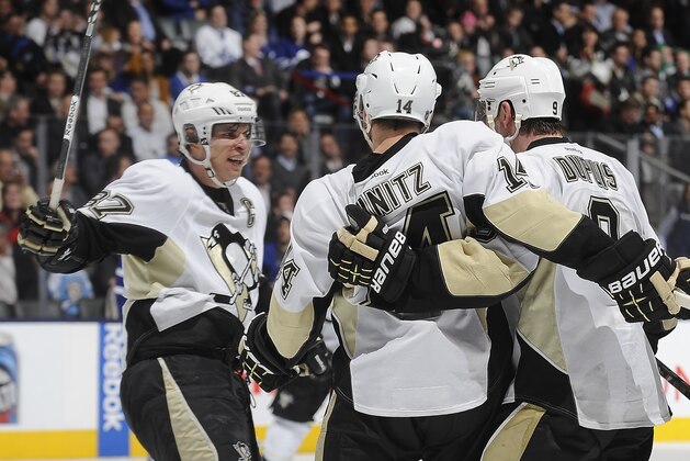 TORONTO, CANADA - MARCH 14:  Sidney Crosby #87, Chris Kunitz #14 and Pascal Dupuis #9 of the Pittsburgh Penguins celebrate a third-period goal during NHL game action against the Toronto Maple Leafs March 14, 2013 at the Air Canada Centre in Toronto, Ontario, Canada. (Photo by Graig Abel/NHLI via Getty Images)