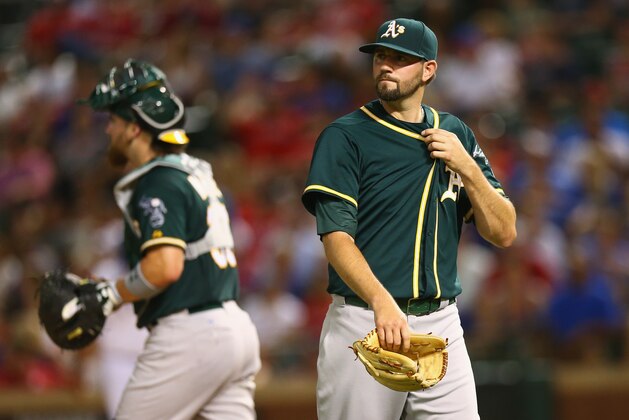 ARLINGTON, TX - JULY 25:  Jason Hammel #40 of the Oakland Athletics leaves the game against the Texas Rangers in the sixth inning at Globe Life Park in Arlington on July 25, 2014 in Arlington, Texas.  (Photo by Ronald Martinez/Getty Images)