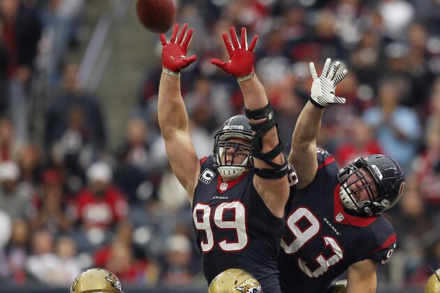 HOUSTON, TX - NOVEMBER 24:  J.J. Watt #99 of the Houston Texans and Jared Crick #93 attempt to block a field goal attempt by Josh Scobee #10 of the Jacksonville Jaguars in the fourth quarter at Reliant Stadium on November 24, 2013 in Houston, Texas.  (Photo by Bob Levey/Getty Images)