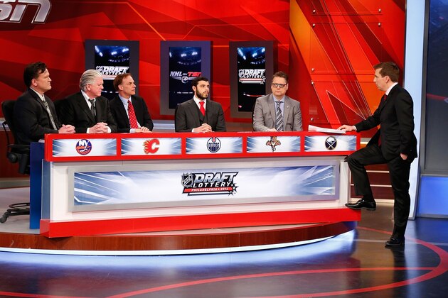 TORONTO, ON - APRIL 15: Broadcast host James Duthie (R) stands with team representatives attending the 2014 NHL Draft Lottery on April 15, 2014 at the TSN Studios in Toronto, Ontario. Seated, from left, are Trent Klatt, head amateur scout, New York Islanders; Brian Burke, president-hockey operations, Toronto Maple Leafs; Scott Howson, senior vice president-hockey operations, Edmonton Oilers; Travis Viola, vice president-hockey operations, Florida Panthers and Tim Murray, general manager, Buffalo Sabres.  (Photo by Bill Wippert/NHLI via Getty Images)