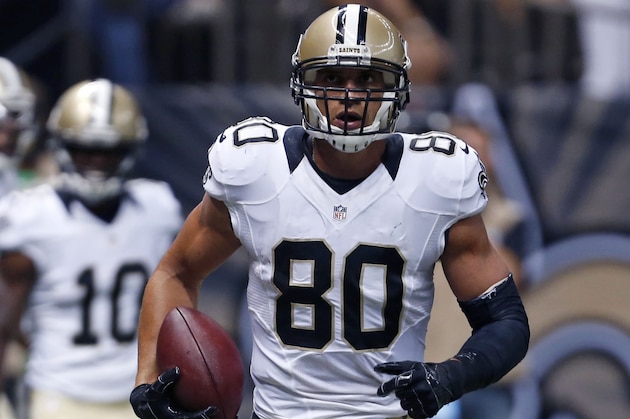 New Orleans Saints tight end Jimmy Graham (80) runs in the end zone on a touchdown reception in the first half of an NFL football game against the Tennessee Titans in New Orleans, Friday, Aug. 15, 2014. (AP Photo/Rogelio Solis)