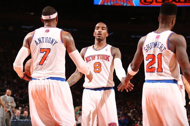 NEW YORK, NY - MARCH 31: J.R. Smith #8 of the New York Knicks high-fives teammates Carmelo Anthony #7 and Iman Shumpert #21 in a game against the Boston Celtics on March 31, 2013 at Madison Square Garden in New York City.  NOTE TO USER: User expressly acknowledges and agrees that, by downloading and or using this photograph, User is consenting to the terms and conditions of the Getty Images License Agreement. Mandatory Copyright Notice: Copyright 2013 NBAE  (Photo by Nathaniel S. Butler/NBAE via Getty Images)