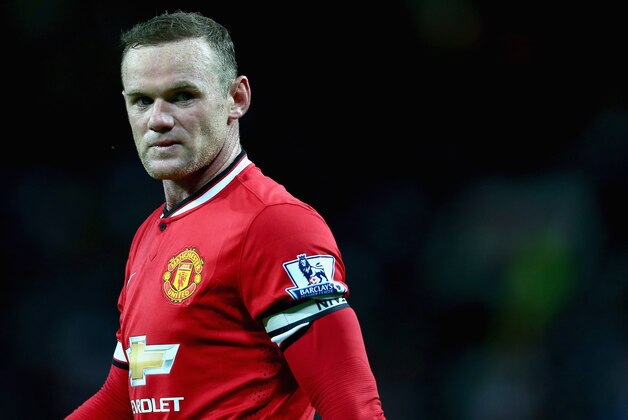 MANCHESTER, ENGLAND - AUGUST 12:  Wayne Rooney of Manchester United in action during the Pre Season Friendly match between Manchester United and Valencia at Old Trafford on August 12, 2014 in Manchester, England.  (Photo by Clive Brunskill/Getty Images)