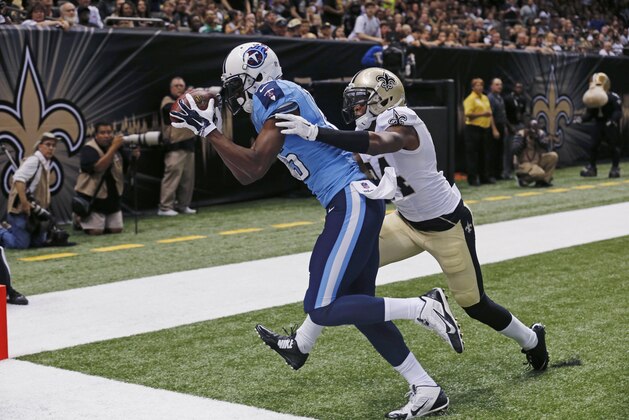 Tennessee Titans wide receiver Justin Hunter (15) pulls in a touchdown reception over New Orleans Saints cornerback Corey White (24) in the first half of an NFL preseason football game in New Orleans, Friday, Aug. 15, 2014. (AP Photo/Bill Haber)