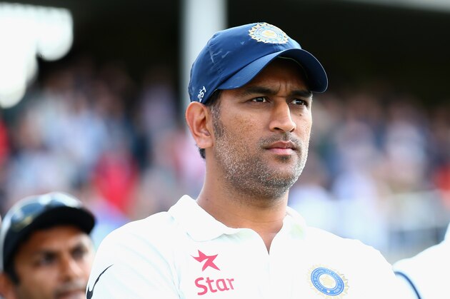 LONDON, ENGLAND - AUGUST 17:  MS Dhoni of India looks on after India lost the match to England during day three of the 5th Investec Test match between England and India at The Kia Oval on August 17, 2014 in London, England.  (Photo by Paul Gilham/Getty Images)