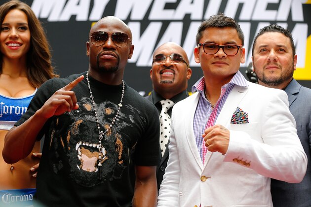 NEW YORK, NY - JULY 14: Marcos Maidana and Floyd Mayweather Jr. pose for a photo during a news conference at the Pedestrian Walk in Times Square on July 14, 2014 in New York City. Floyd Mayweather Jr. and Marcos Maidana are scheduled to fight September 13, 2014 at the MGM Grand in Las Vegas. (Photo by Mike Stobe/Getty Images) NEW YORK, NY - JULY 14: Marcos Maidana and Floyd Mayweather Jr. pose for a photo during a news conference at the Pedestrian Walk in Times Square on July 14, 2014 in New York City. Floyd Mayweather Jr. and Marcos Maidana are scheduled to fight September 13, 2014 at the MGM Grand in Las Vegas. (Photo by Mike Stobe/Getty Images)