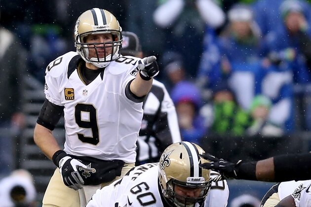 SEATTLE, WA - JANUARY 11:  Quarterback Drew Brees #9 of the New Orleans Saints points from under center in the second quarter against the Seattle Seahawks during the NFC Divisional Playoff Game at CenturyLink Field on January 11, 2014 in Seattle, Washington.  (Photo by Jeff Gross/Getty Images)
