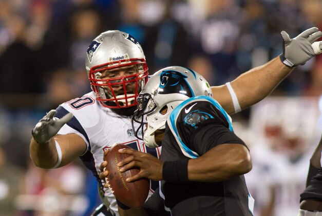 Nov 18, 2013; Charlotte, NC, USA; New England Patriots defensive end Rob Ninkovich (50) sacks Carolina Panthers quarterback Cam Newton (1) during the fourth quarter at Bank of America Stadium. The Panthers defeated the Patriots 24-20. Mandatory Credit: Jeremy Brevard-USA TODAY Sports