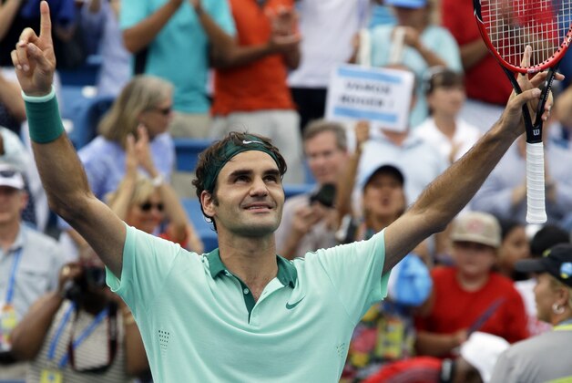 Roger Federer, from Switzerland, celebrates after defeating David Ferrer, from Spain, 6-3, 1-6, 6-2, in a final match at the Western and Southern Open tennis tournament, Sunday, Aug. 17, 2014, in Mason, Ohio. (AP Photo/Al Behrman)