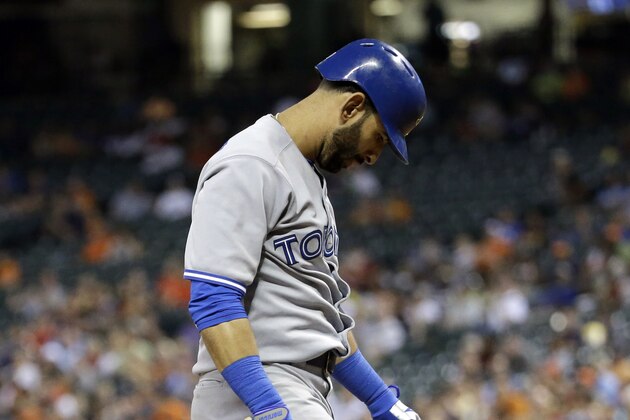 Toronto Blue Jays' Jose Bautista looks down after striking out against the Houston Astros during the eighth inning of a baseball game Friday, Aug. 1, 2014, in Houston. (AP Photo/David J. Phillip)