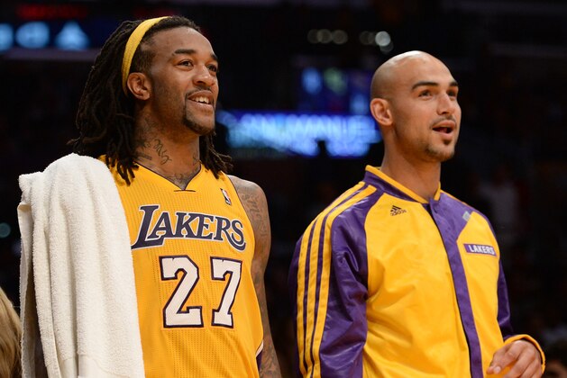 LOS ANGELES, CA - NOVEMBER 12:  Jordan Hill #27 of the Los Angeles Lakers and Robert Sacre #50 react to the dunk of Xavier Henry #7 during a 116-95 win over the New Orleans Pelicans at Staples Center on November 12, 2013 in Los Angeles, California.  NOTE TO USER: User expressly acknowledges and agrees that, by downloading and or using this Photograph, user is consenting to the terms and condition of the Getty Images License Agreement.  (Photo by Harry How/Getty Images)