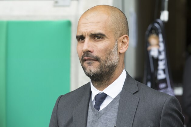 Munich's coach Pep Guardiola   watches his team during the German soccer cup first round match between SC Preussen Muenster and FC Bayern Munich in Muenster, Germany, Sunday, Aug. 17, 2014. (AP Photo/Joerg Sarbach)