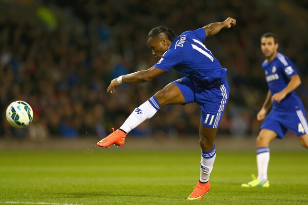 BURNLEY, ENGLAND - AUGUST 18:  Didier Drogba of Chelsea shoots at goal during the Barclays Premier League match between Burnley and Chelsea at Turf Moor on August 18, 2014 in Burnley, England.  (Photo by Clive Brunskill/Getty Images)