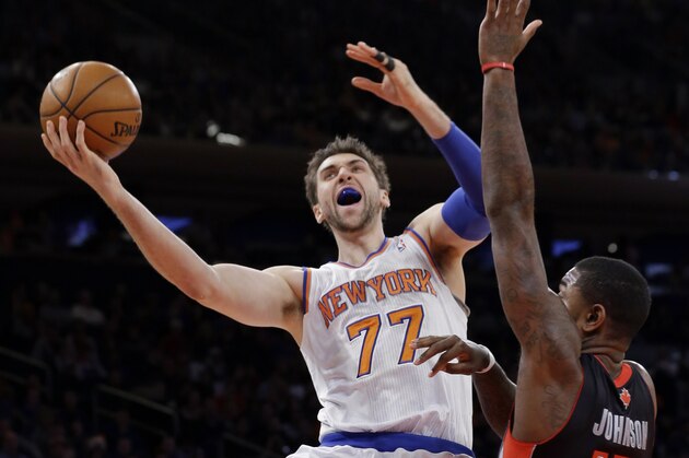 New York Knicks' Andrea Bargnani (77), of Italy, shoots over Toronto Raptors' Amir Johnson (15) as Kyle Lowry (7) watches during the first half of an NBA basketball game Friday, Dec. 27, 2013, in New York. (AP Photo/Frank Franklin II) New York Knicks' Andrea Bargnani (77), of Italy, shoots over Toronto Raptors' Amir Johnson (15) as Kyle Lowry (7) watches during the first half of an NBA basketball game Friday, Dec. 27, 2013, in New York. (AP Photo/Frank Franklin II)