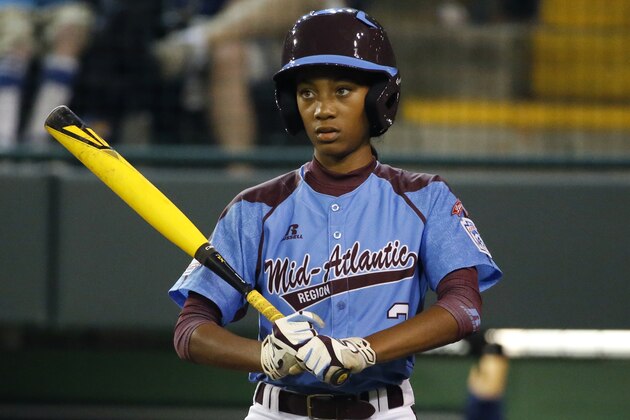 Philadelphia pitcher Mo'ne Davis looks for a sign during the fourth inning of a United States semi-final baseball game against Las Vegas at the Little League World Series tournament in South Williamsport, Pa., Tuesday, Aug. 20, 2014. Las Vegas won 8-1, with Mo'ne giving up three runs in 2 and 2/3 innings. (AP Photo/Gene J. Puskar)
