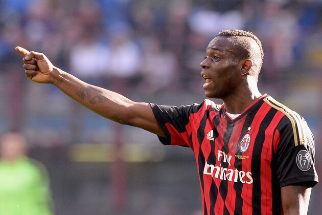 MILAN, ITALY - MARCH 16:  Mario Balotelli of AC Milan reacts during the Serie A match between AC Milan and Parma FC at San Siro Stadium on March 16, 2014 in Milan, Italy.  (Photo by Claudio Villa/Getty Images)