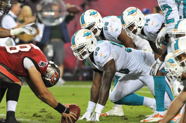 TAMPA, FL - NOVEMBER 11:  Defensive end Dion Jordan #95 of the Miami Dolphins sets on defense against the Tampa Bay Buccaneers November 11, 2013 at Raymond James Stadium in Tampa, Florida. (Photo by Al Messerschmidt/Getty Images)