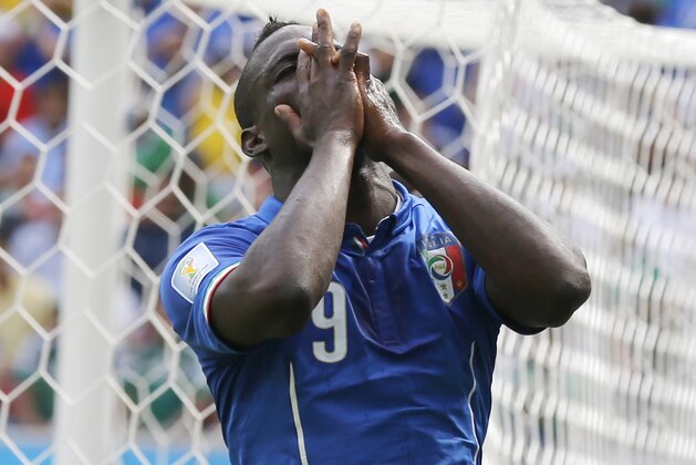 Italy's Mario Balotelli reacts after missing a chance during the group D World Cup soccer match between Italy and Costa Rica at the Arena Pernambuco in Recife, Brazil, Friday, June 20, 2014.  (AP Photo/Frank Augstein)
