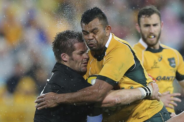 New Zealand All Black captain Richie McCaw left, and Australian Wallabies Kurtley Beale clash while chasing the ball during their Bledisloe Cup rugby test match against the  in Sydney, Australia, Saturday, Aug. 16, 2014. The match was a draw  at 12-12.(AP Photo/Rob Griffith)