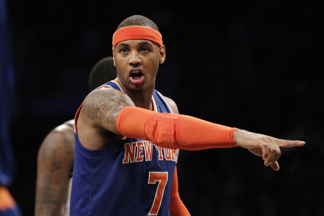 New York Knicks forward Carmelo Anthony (7) gives instructions to a teammate in the second half of their their NBA basketball game at the Barclays Center, Tuesday, Dec. 11, 2012, in New York. The Knicks defeated the Nets 100-97. (AP Photo/Kathy Willens)