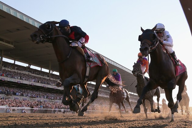 ELMONT, NY - JUNE 07:  Tonalist #11 (L), ridden by Joel Rosario, races to the finish line enroute to winning the 146th running of the Belmont Stakes at Belmont Park on June 7, 2014 in Elmont, New York.  (Photo by Rob Carr/Getty Images)