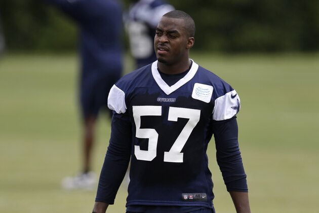 Dallas Cowboys' DeVonte Holloman (57) walks over to the practice field after doing some rehab work during an NFL football organized team activity, Monday, June 2, 2014, in Irving, Texas. (AP Photo/Tony Gutierrez)
