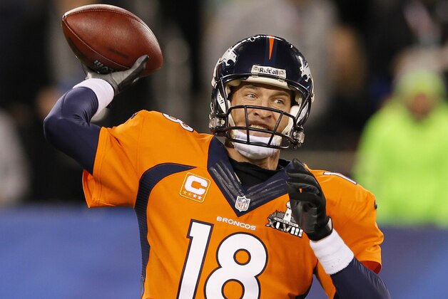 EAST RUTHERFORD, NJ - FEBRUARY 02:  Quarterback Peyton Manning #18 of the Denver Broncos throws a pass against the Seattle Seahawks in the second quarter during Super Bowl XLVIII at MetLife Stadium on February 2, 2014 in East Rutherford, New Jersey.  (Photo by Kevin C. Cox/Getty Images)