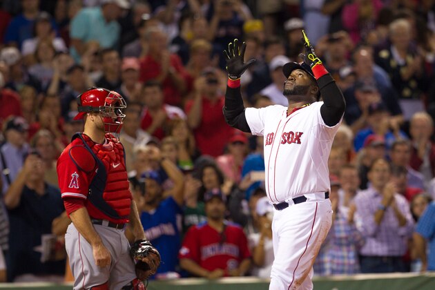 BOSTON, MA - AUGUST 20: David Ortiz #34 of the Boston Red Sox celebrates as Chris Iannetta #17 of the Los Angeles Angels of Anaheim watches after he homered during the third inning at Fenway Park on August 20, 2014 in Boston, Massachusetts. (Photo by Rich Gagnon/Getty Images)
