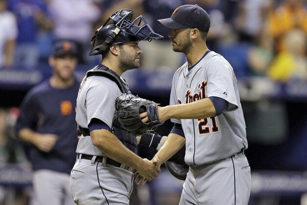 Detroit Tigers starting pitcher Rick Porcello, right, shakes hands with catcher Alex Avila after throwing a complete game, three-hit, shut of the Tampa Bay Rays during a baseball game Wednesday, Aug. 20, 2014, in St. Petersburg, Fla. The Tigers won the game 6-0. (AP Photo/Chris O'Meara)