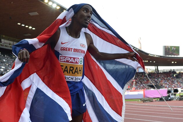Britain's Mo Farah celebrates winning the gold medal in the men's 5000m final during the European Athletics Championships in Zurich, Switzerland, Sunday, Aug. 17, 2014. (AP Photo/Martin Meissner)