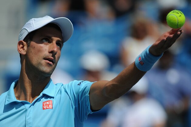 CINCINNATI, OH - AUGUST 14:  Novak Djokovic of Serbia serves against Tommy Robredo of Spain during a match on day 6 of the Western & Southern Open at the Linder Family Tennis Center on August 14, 2014 in Cincinnati, Ohio.  (Photo by Jonathan Moore/Getty Images)