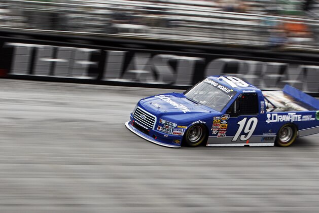 Driver Brad Keselowski (19) goes through Turn 3 during the NASCAR UNOH 200 Truck Series auto race on Thursday, Aug. 21, 2014, in Bristol, Tenn. (AP Photo/Wade Payne)