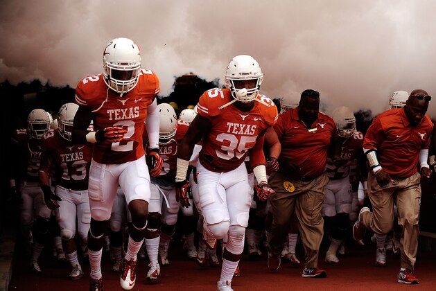 AUSTIN, TX - NOVEMBER 16:  The Texas Longhorns take the field for the second half during a game against the Oklahoma State Cowboys at Darrell K Royal-Texas Memorial Stadium on November 16, 2013 in Austin, Texas.  Oklahoma State won the game 38-13.  (Photo by Stacy Revere/Getty Images)