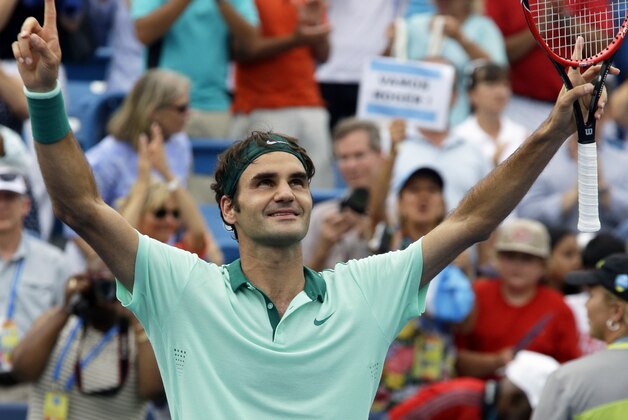 Roger Federer, from Switzerland, celebrates after defeating David Ferrer, from Spain, 6-3, 1-6, 6-2, in a final match at the Western and Southern Open tennis tournament, Sunday, Aug. 17, 2014, in Mason, Ohio. (AP Photo/Al Behrman)