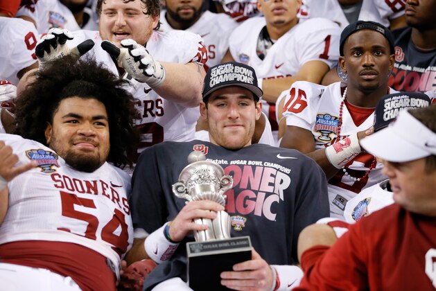 NEW ORLEANS, LA - JANUARY 02:  Head coach Bob Stoops and MVP Trevor Knight #9 of the Oklahoma Sooners celebrate after their 45-31 win over the Alabama Crimson Tide during the Allstate Sugar Bowl at the Mercedes-Benz Superdome on January 2, 2014 in New Orleans, Louisiana.  (Photo by Kevin C. Cox/Getty Images)