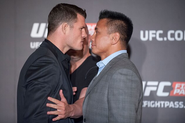 HONG KONG - AUGUST 20: Michael Bisping and Cung Le at a face offs event during the Macao UFC Fight Night Press Conference at the Four Season Hotel on August 20, 2014 in Hong Kong. (Photo by Anthony Kwan/Getty Images) HONG KONG - AUGUST 20: Michael Bisping and Cung Le at a face offs event during the Macao UFC Fight Night Press Conference at the Four Season Hotel on August 20, 2014 in Hong Kong. (Photo by Anthony Kwan/Getty Images)
